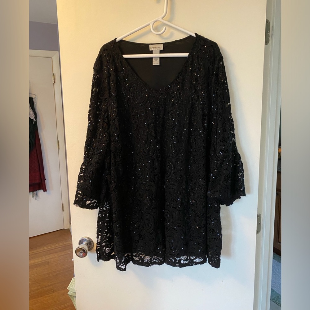 Black sequined top with bell sleeves